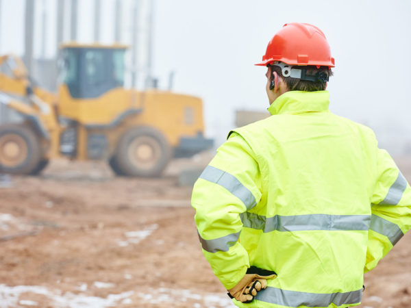 construction foreman worker is watching building works on site